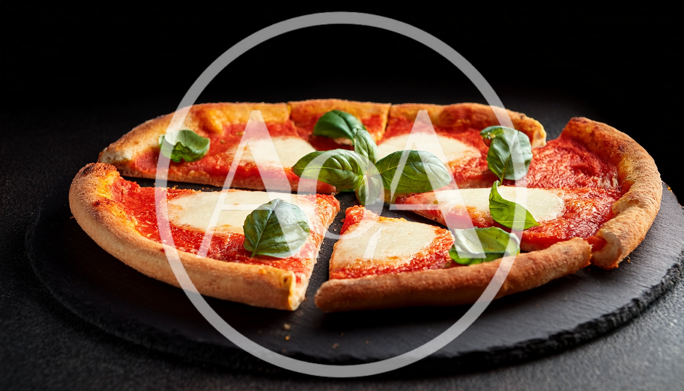 Fresh Margherita Pizza With Basil On Slate Board