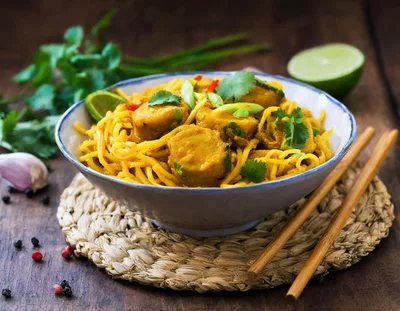 Bowl Of Yellow Curry Noodles With Vegetables