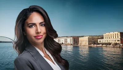 Professional Businesswoman Standing Before A Waterfront Cityscape