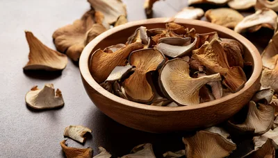 Dried Oyster Mushrooms In A Wooden Bowl