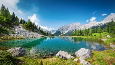 Crystal Clear Alpine Lake With Mountain Peaks
