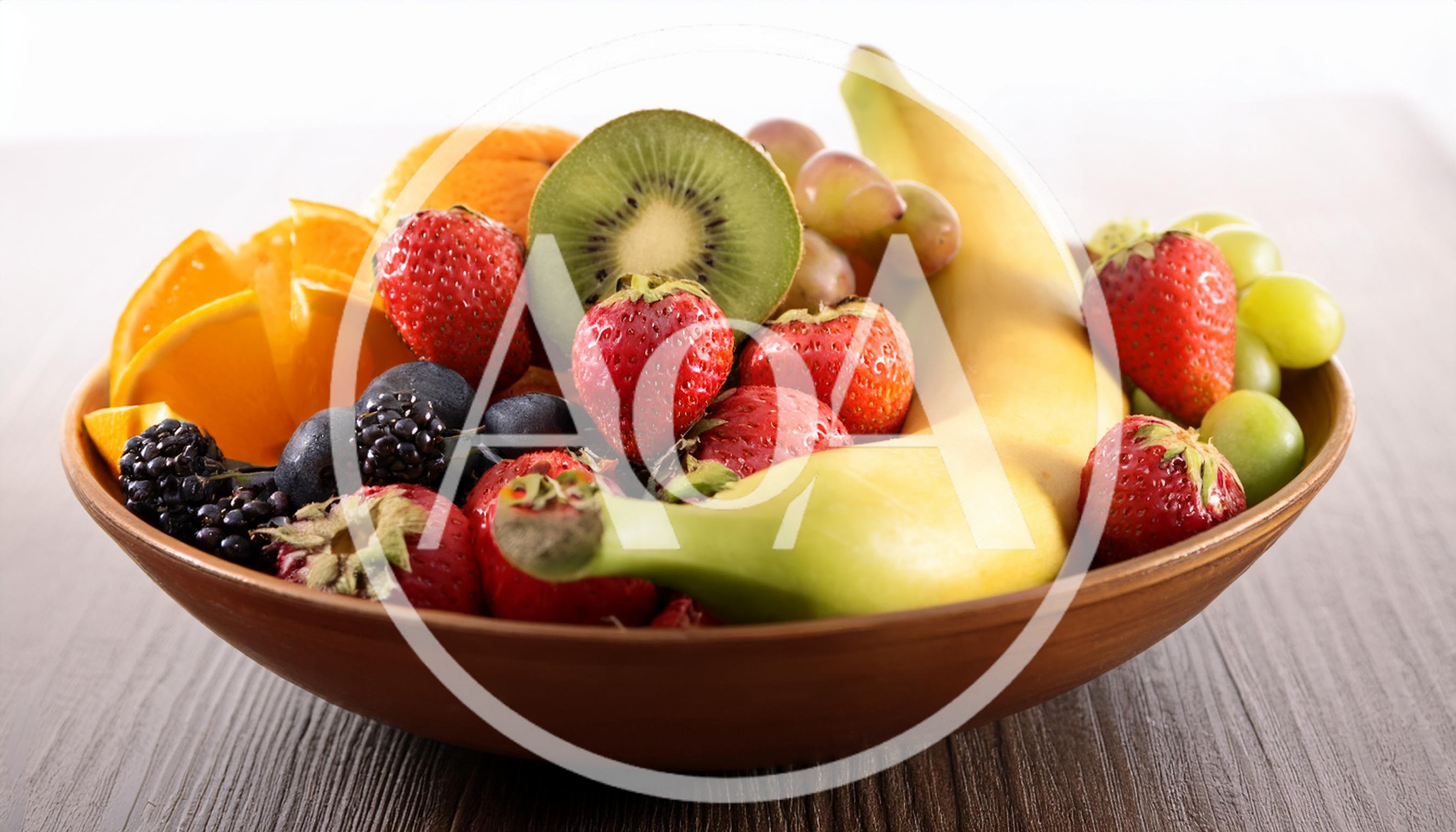 Fresh Assorted Fruits In A Rustic Ceramic Bowl