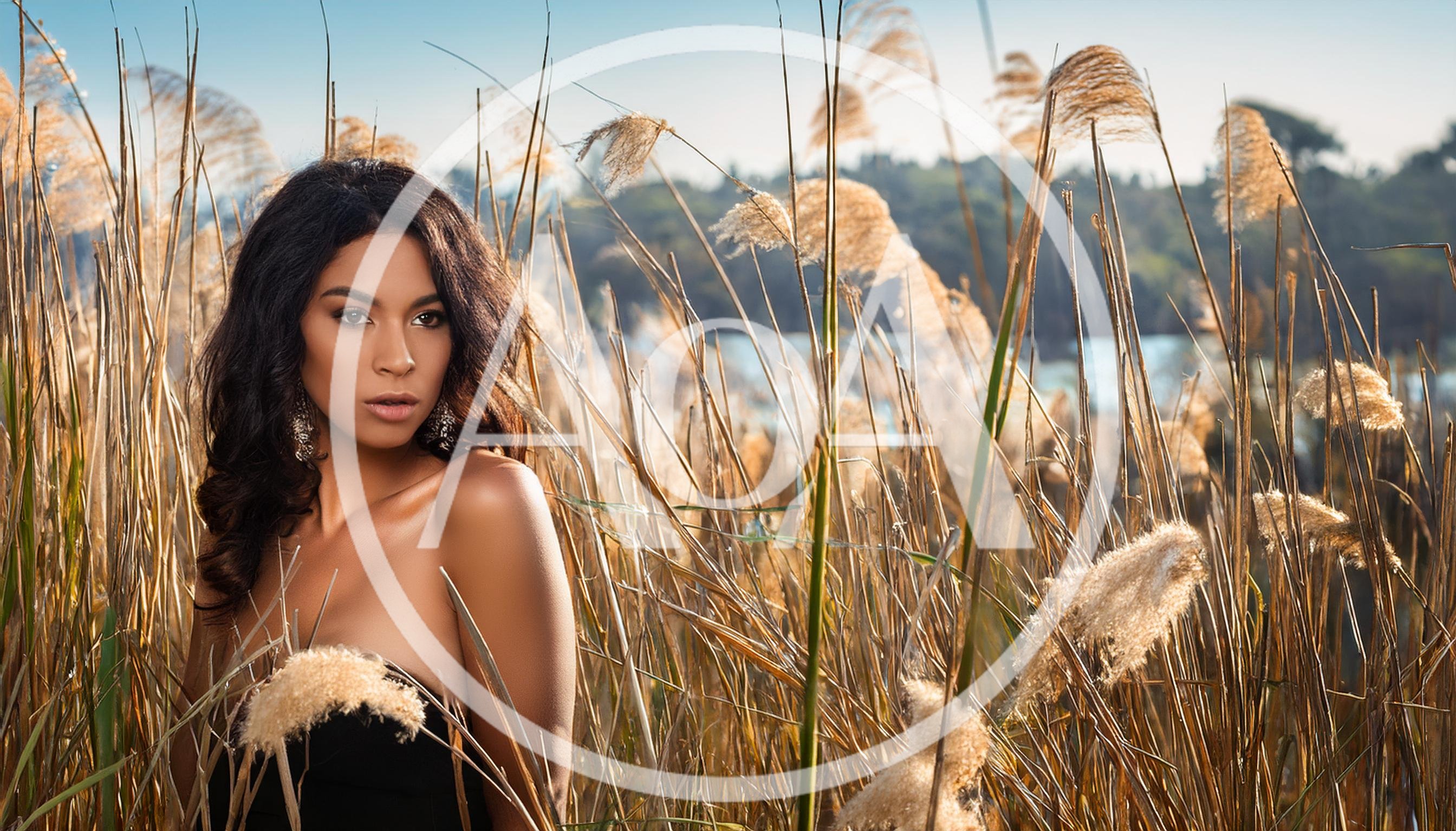 Portrait Of A Beautiful Woman In Tall Grass