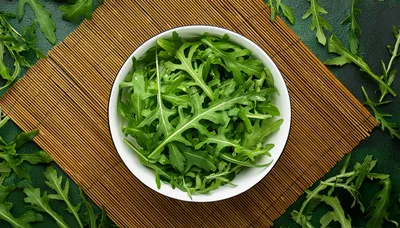 Fresh Arugula Leaves In A White Bowl