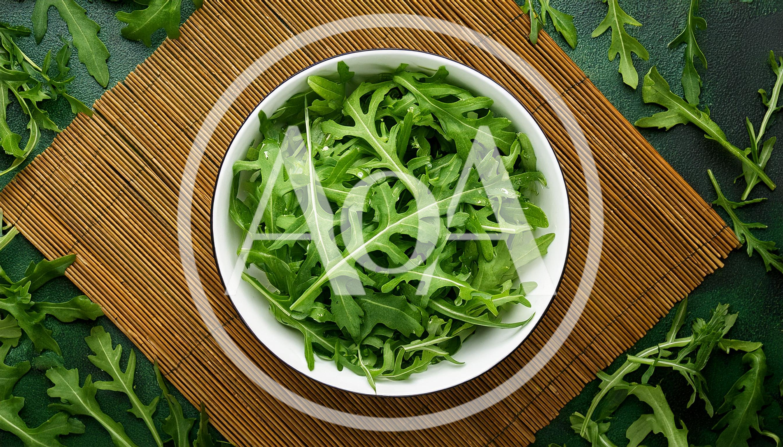 Fresh Arugula Leaves In A White Bowl