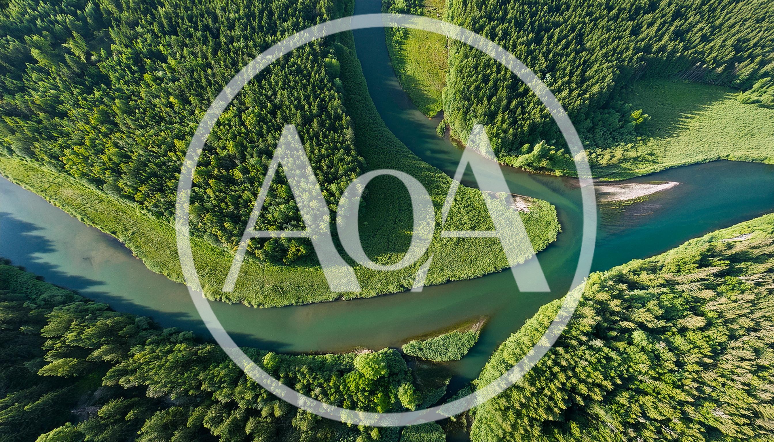 Aerial View Of A Meandering River Through Dense Forest