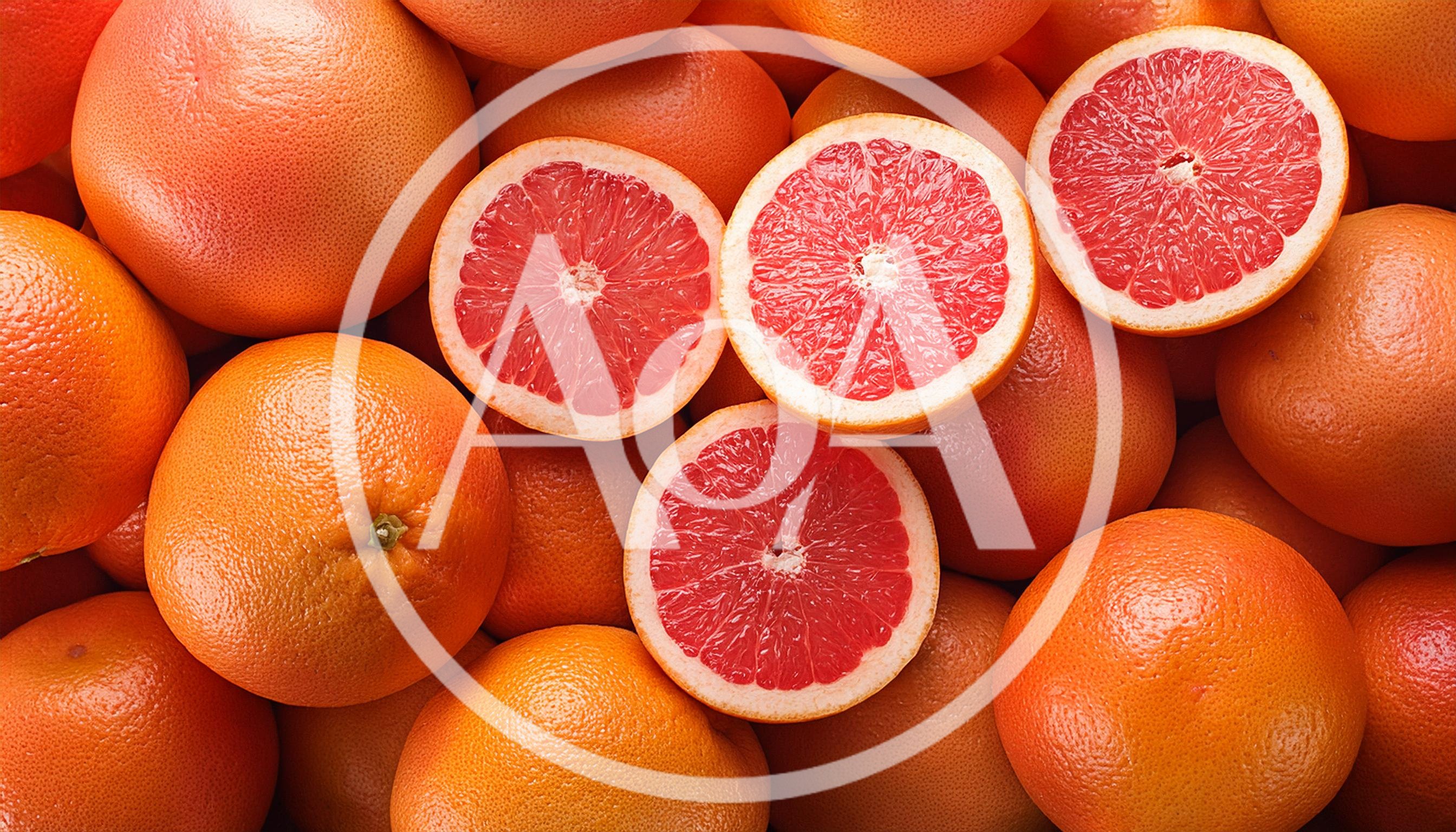 Fresh Ruby Red Grapefruit Halves And Whole Fruits