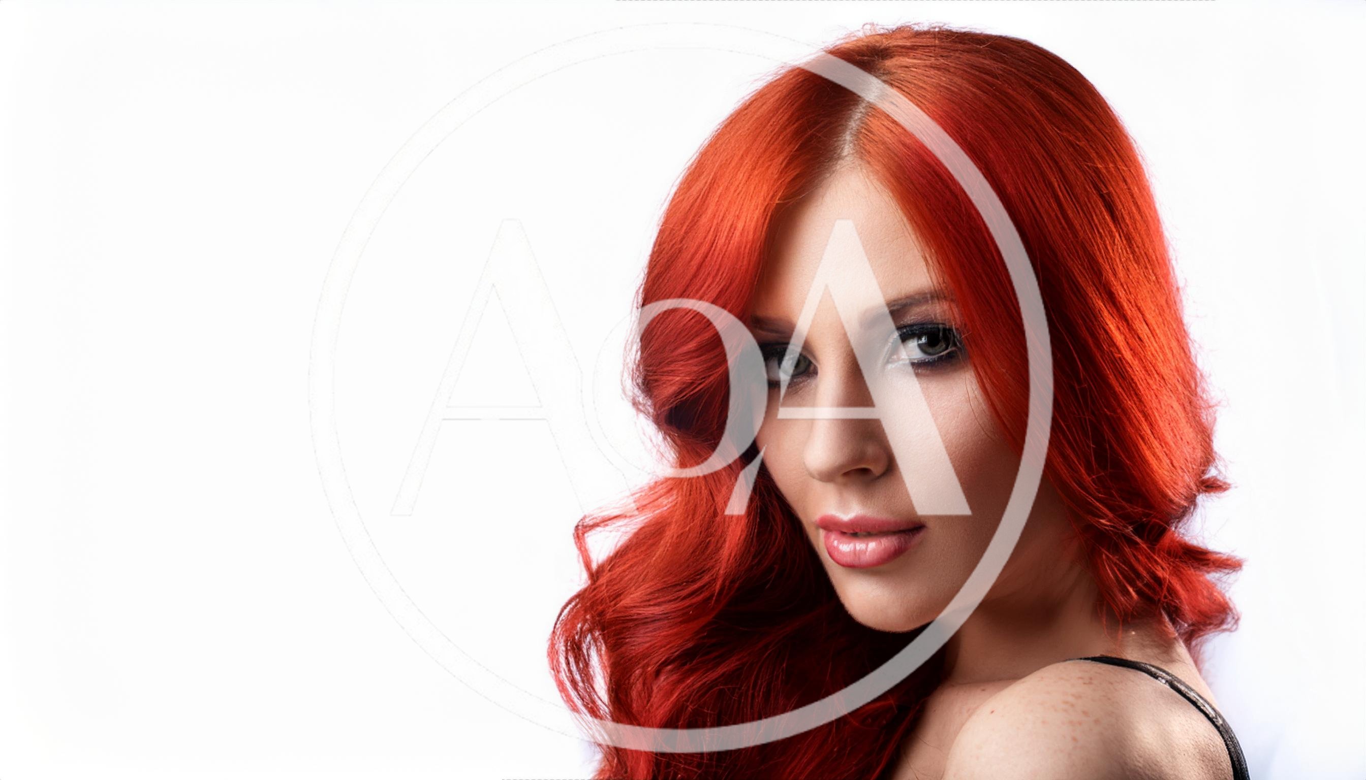 Portrait Of A Beautiful Woman With Vibrant Red Hair