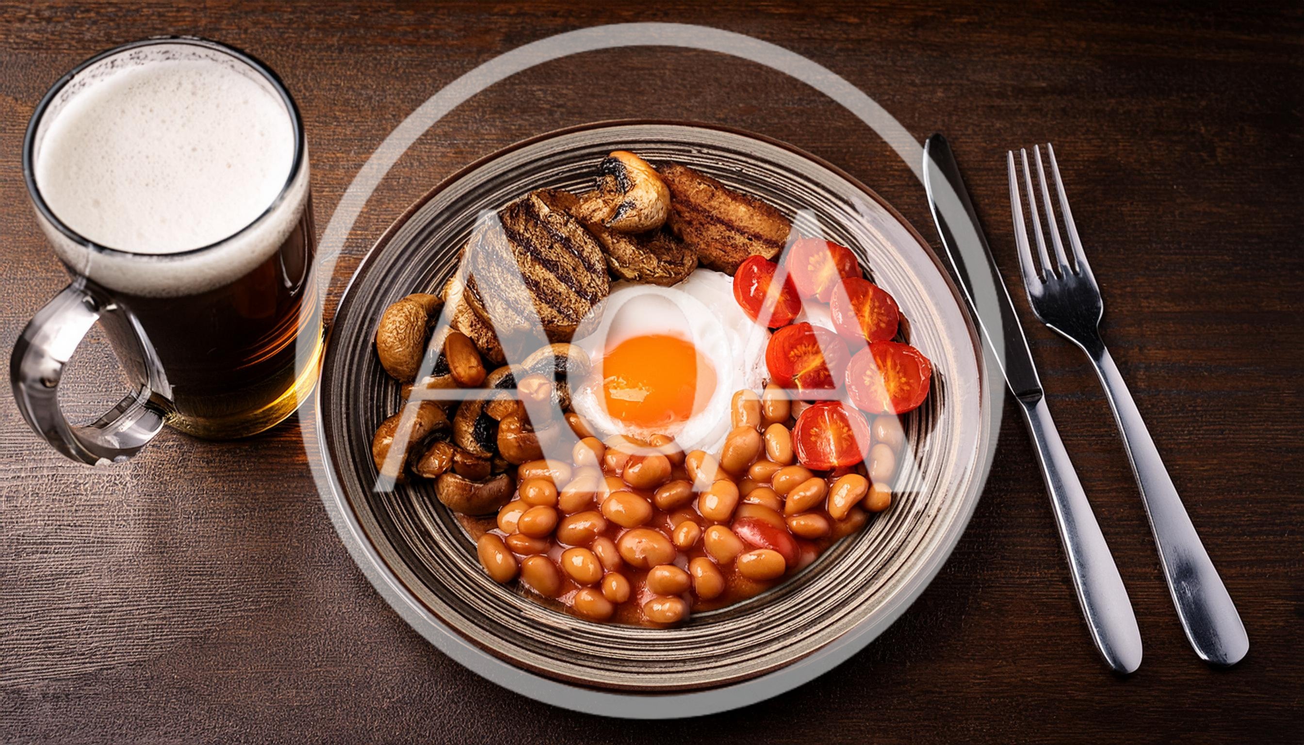 Full English Breakfast With Beer On Wooden Table
