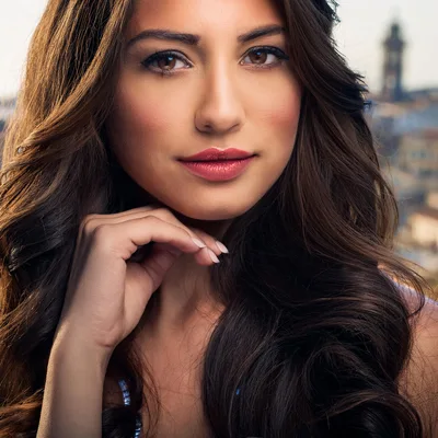 Portrait Of A Beautiful Woman With Long Wavy Hair