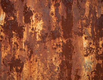 Weathered Metal Surface With Heavy Rust And Peeling Paint