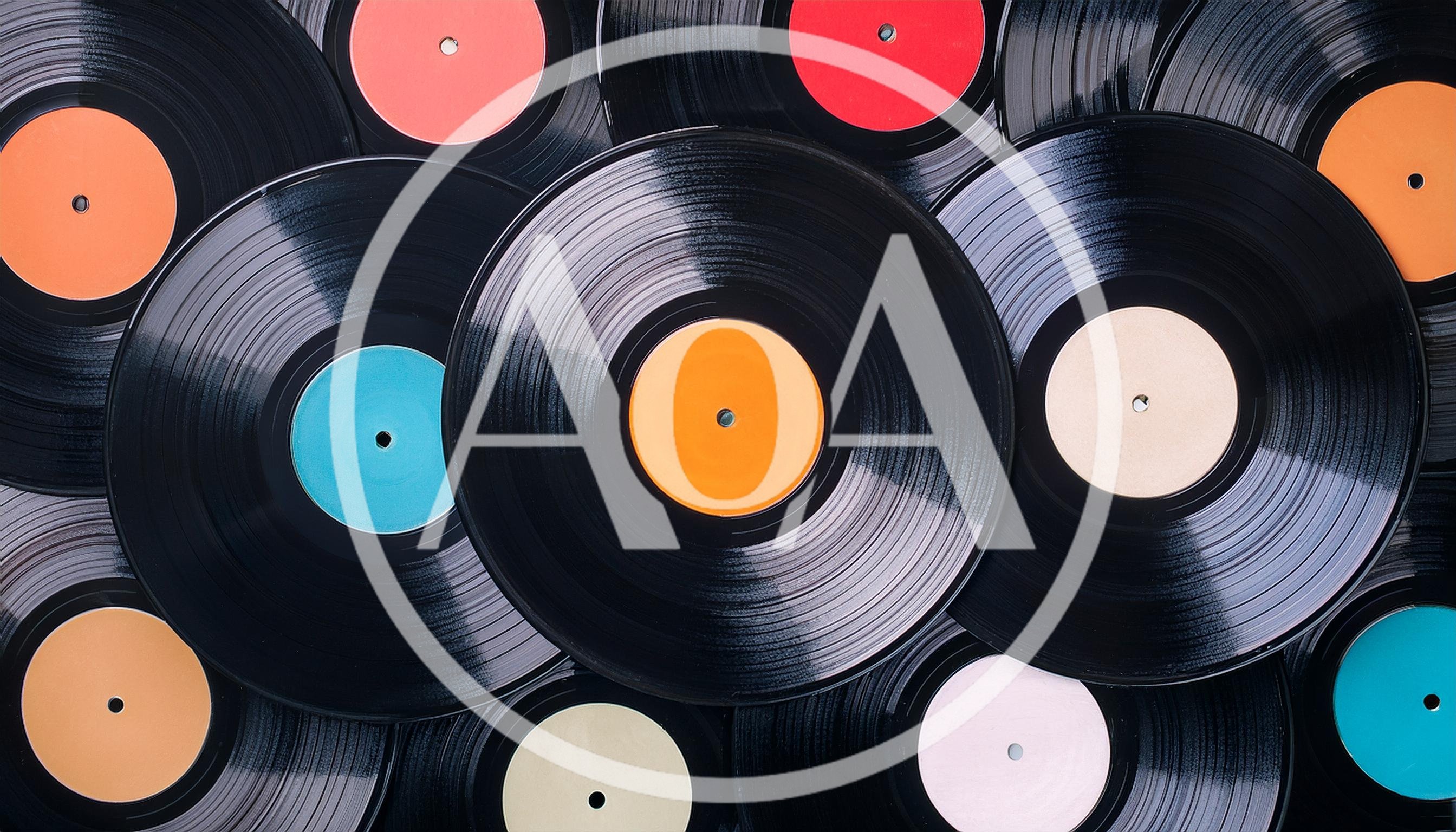 Collection Of Vintage Vinyl Records With Colorful Labels