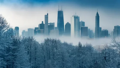 Winter Cityscape With Skyscrapers Emerging From Dense Fog