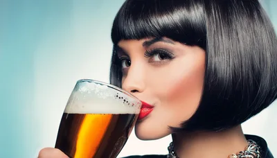 Woman With Bob Haircut Drinking Beer From Glass