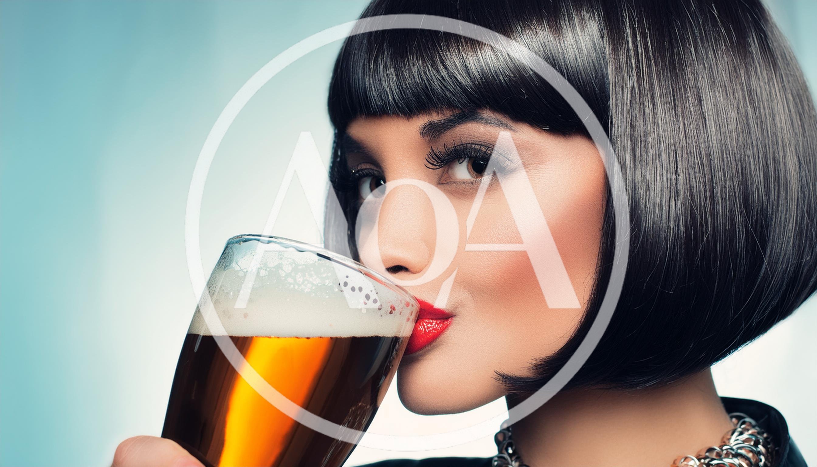Woman With Bob Haircut Drinking Beer From Glass