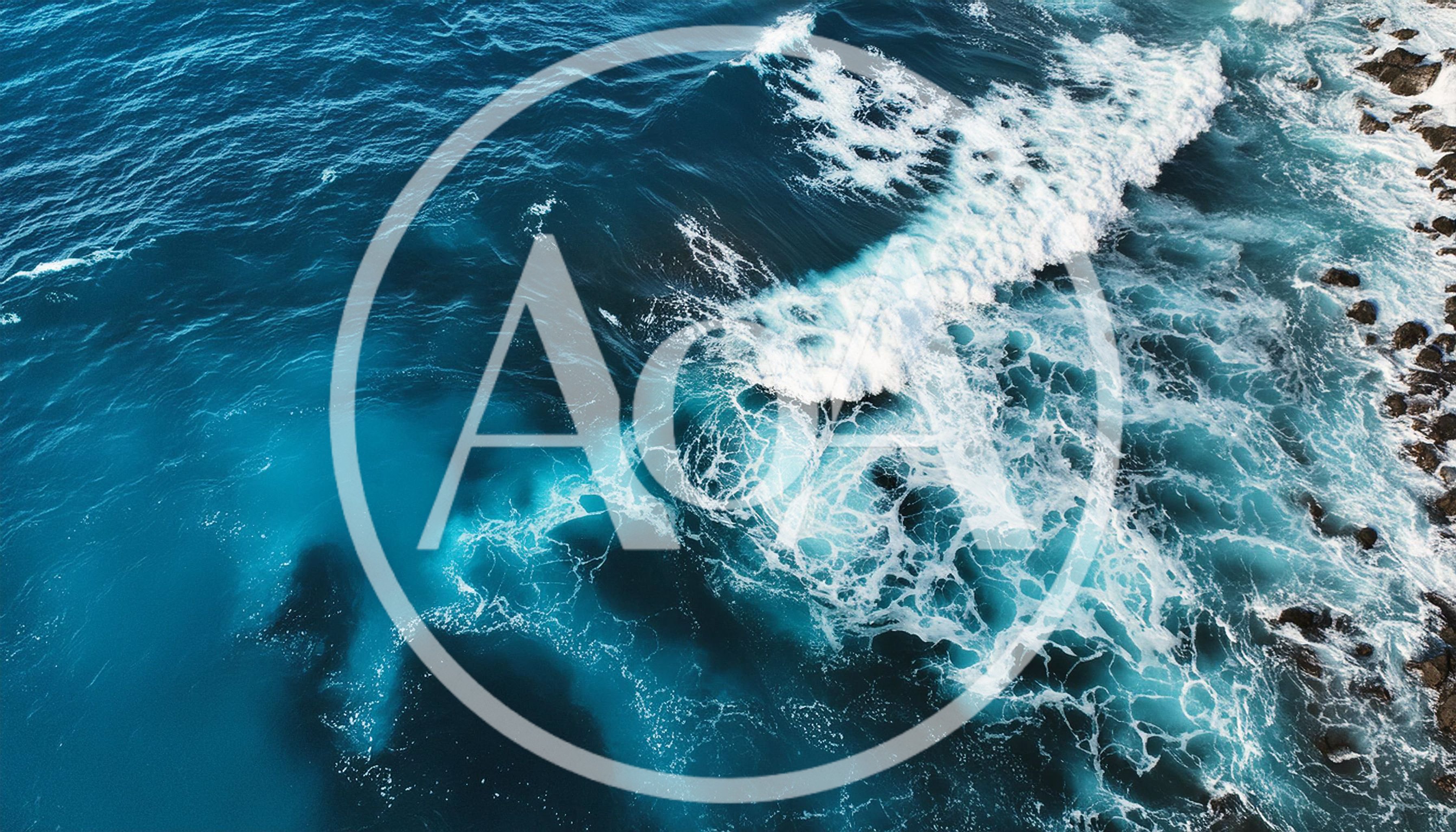 Aerial View Of Ocean Waves Crashing Against Rocky Shoreline