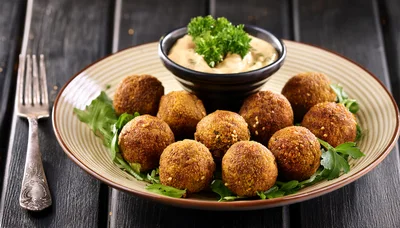 Plate Of Crispy Falafel Balls With Dipping Sauce