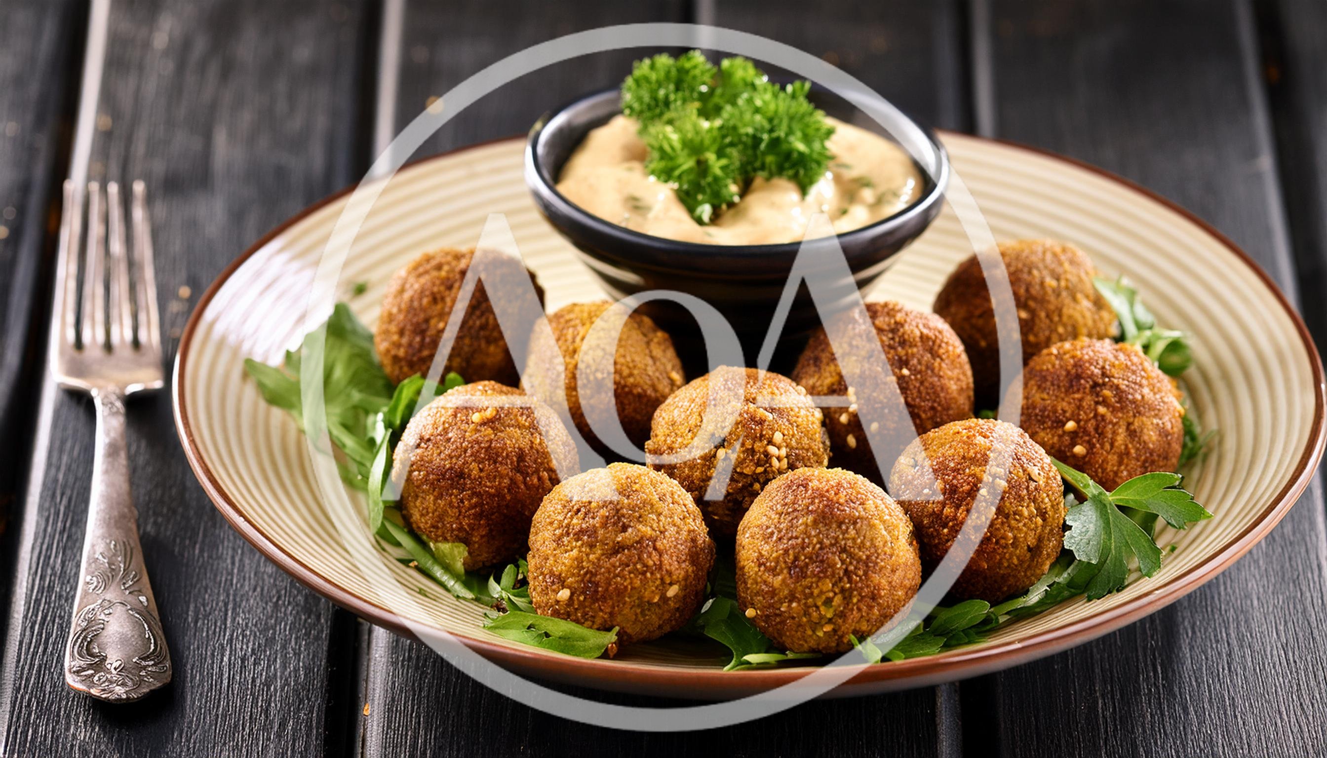 Plate Of Crispy Falafel Balls With Dipping Sauce