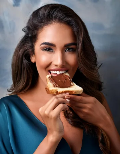 Beautiful Woman Eating A Slice Of Chocolate Spread Toast
