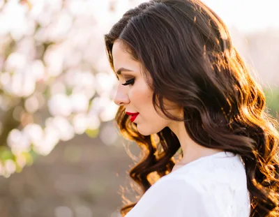 Profile Portrait Of A Beautiful Woman In Spring Orchard