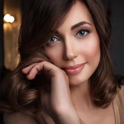 Portrait Of A Beautiful Woman With Wavy Brown Hair