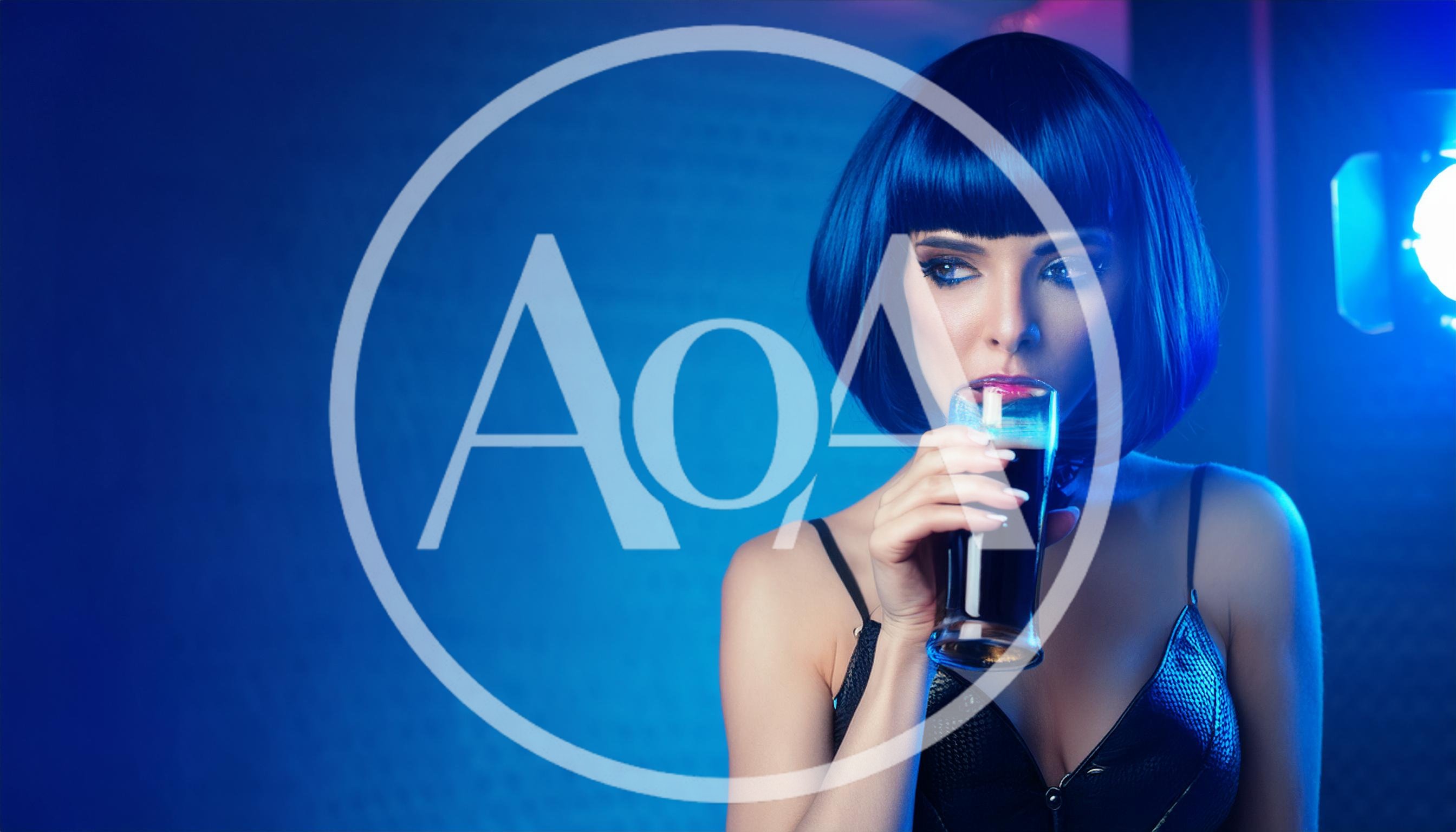 Woman With Blue Bob Hair Drinking Dark Beverage