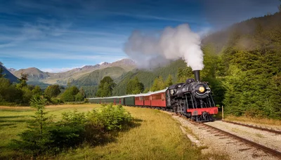 Vintage Steam Locomotive Pulling Passenger Train Through Mountains