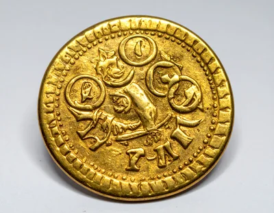 Ancient Gold Coin With Intricate Embossed Heraldic Design