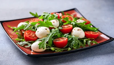 Fresh Caprese Salad With Arugula And Mozzarella