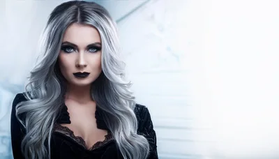 Portrait Of A Woman With Silver Hair And Dark Makeup