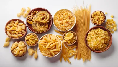 Assorted Dry Pasta Varieties in Wooden Bowls