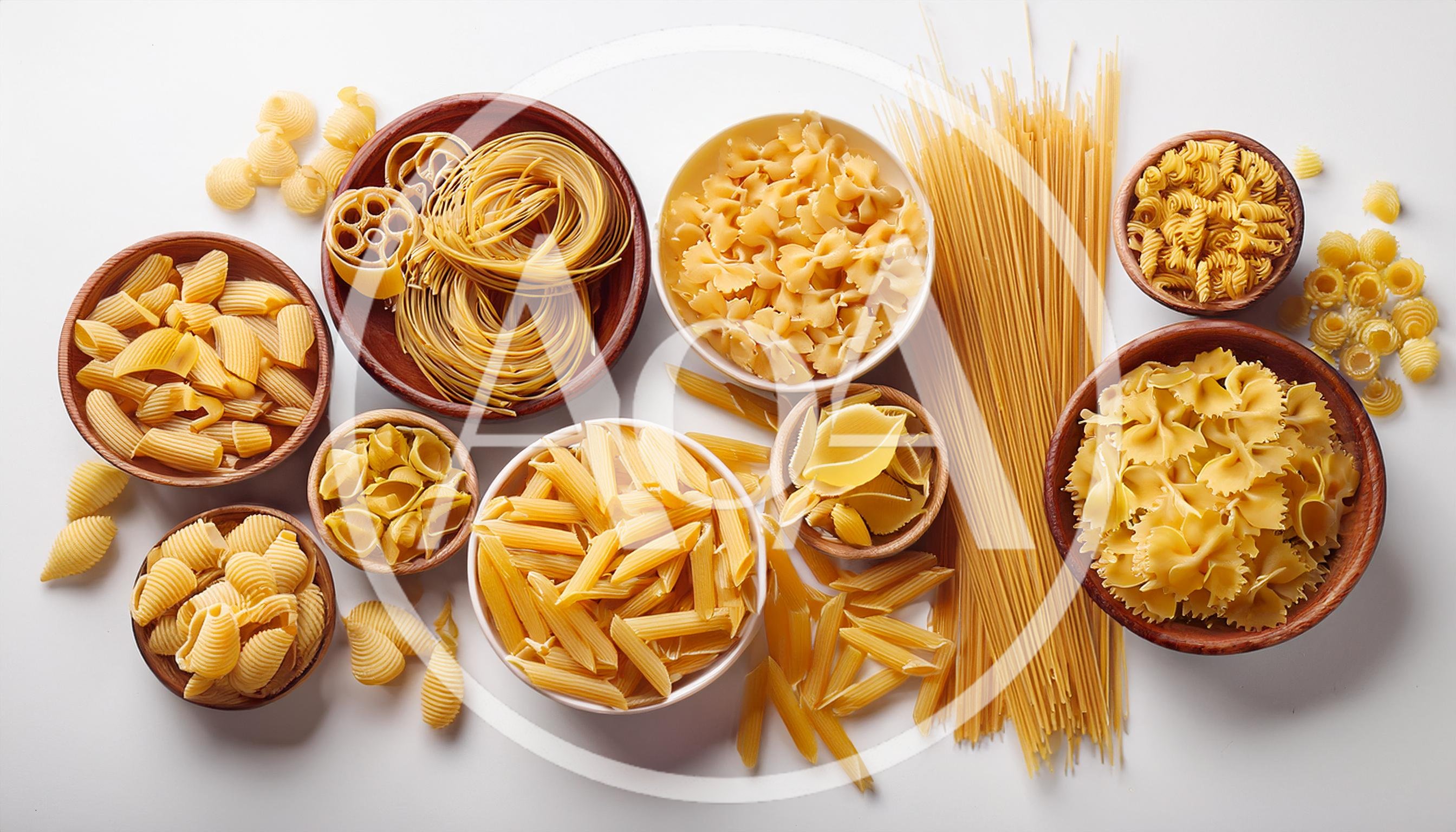 Assorted Dry Pasta Varieties in Wooden Bowls