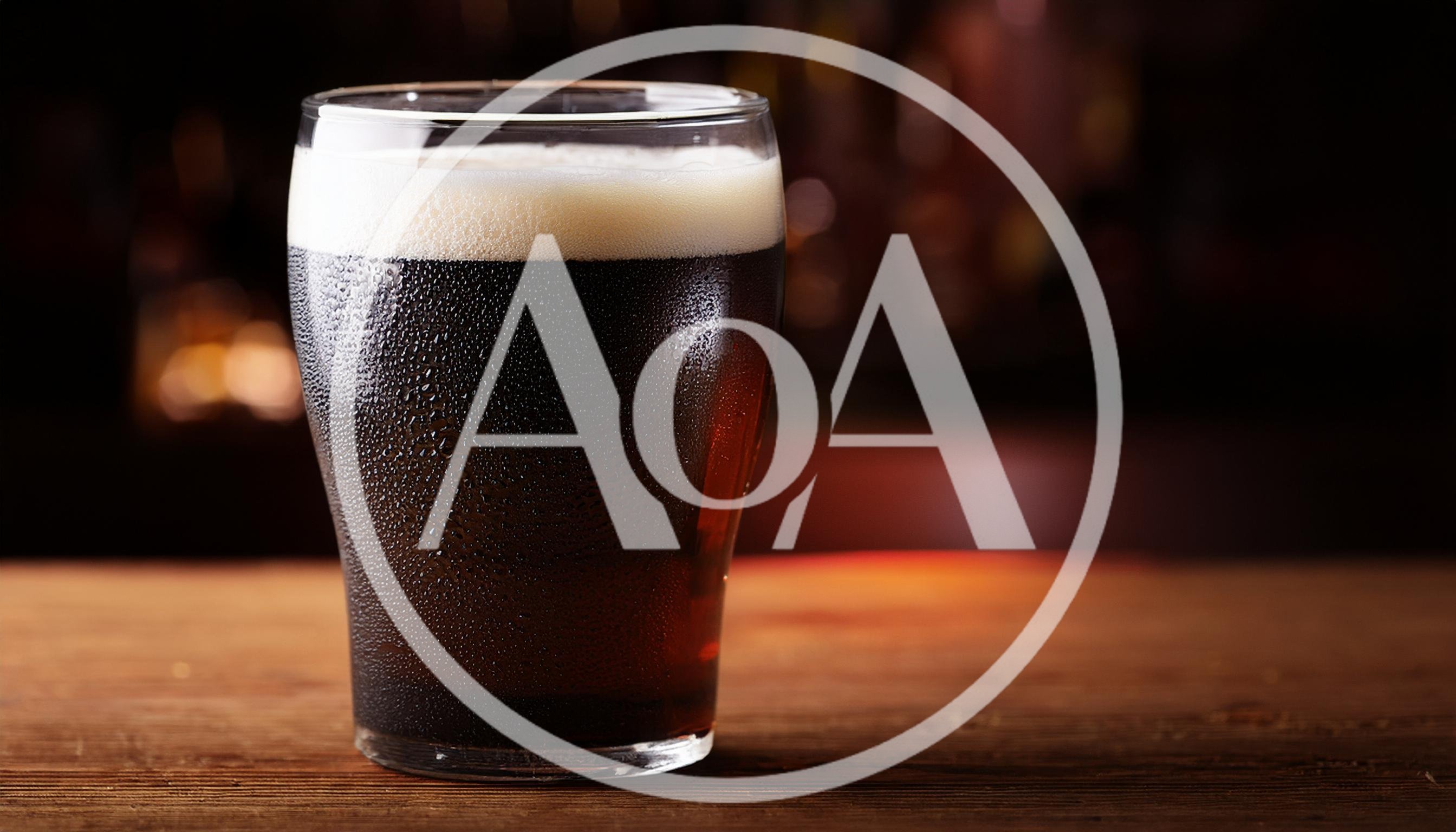 Cold Glass Of Dark Stout Beer On Wooden Table