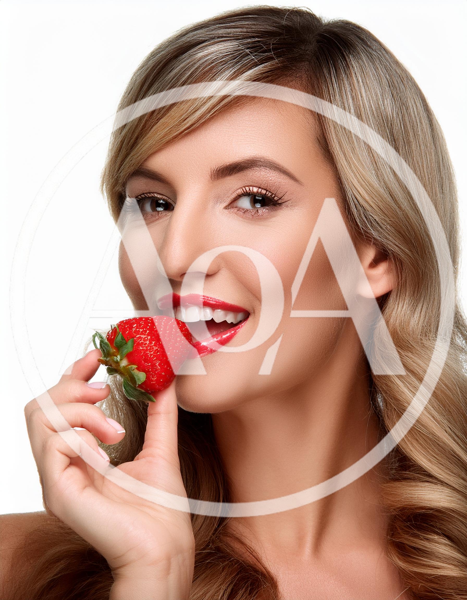 Beautiful Blonde Woman Eating A Fresh Red Strawberry