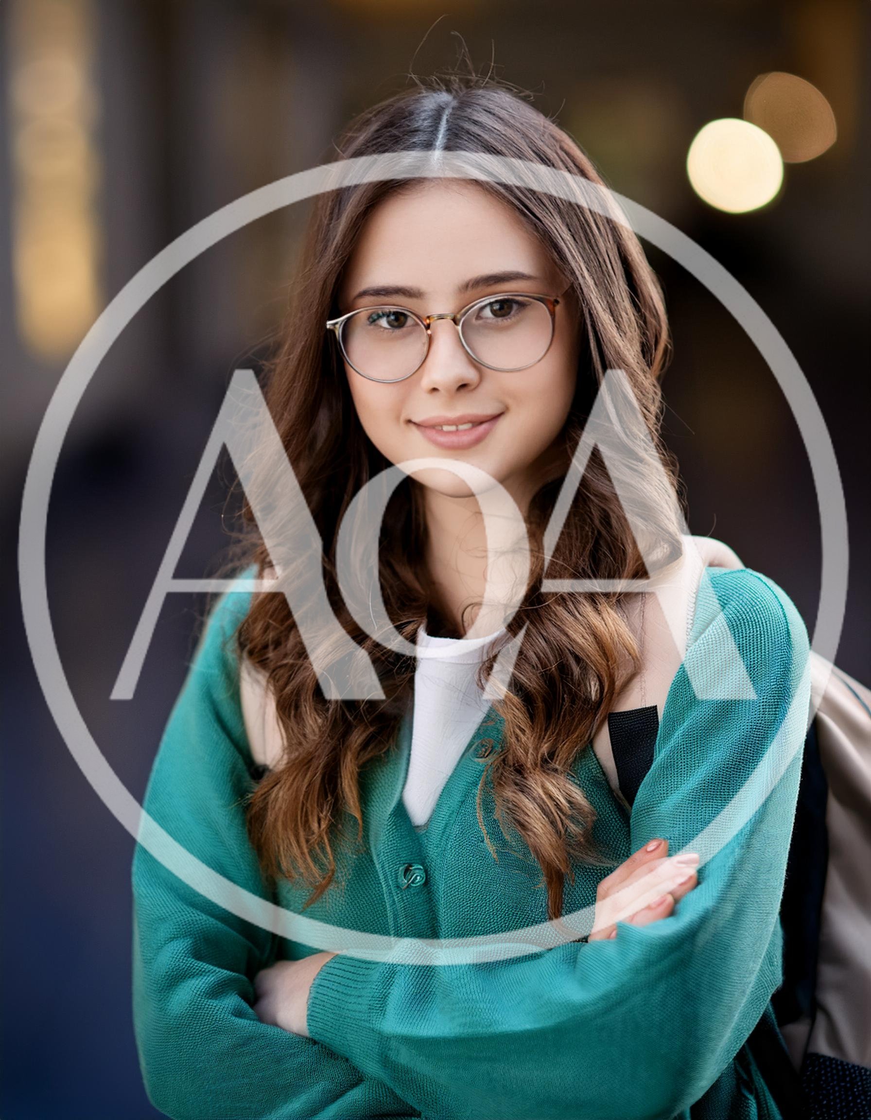 Portrait Of A Young Female Student With Glasses