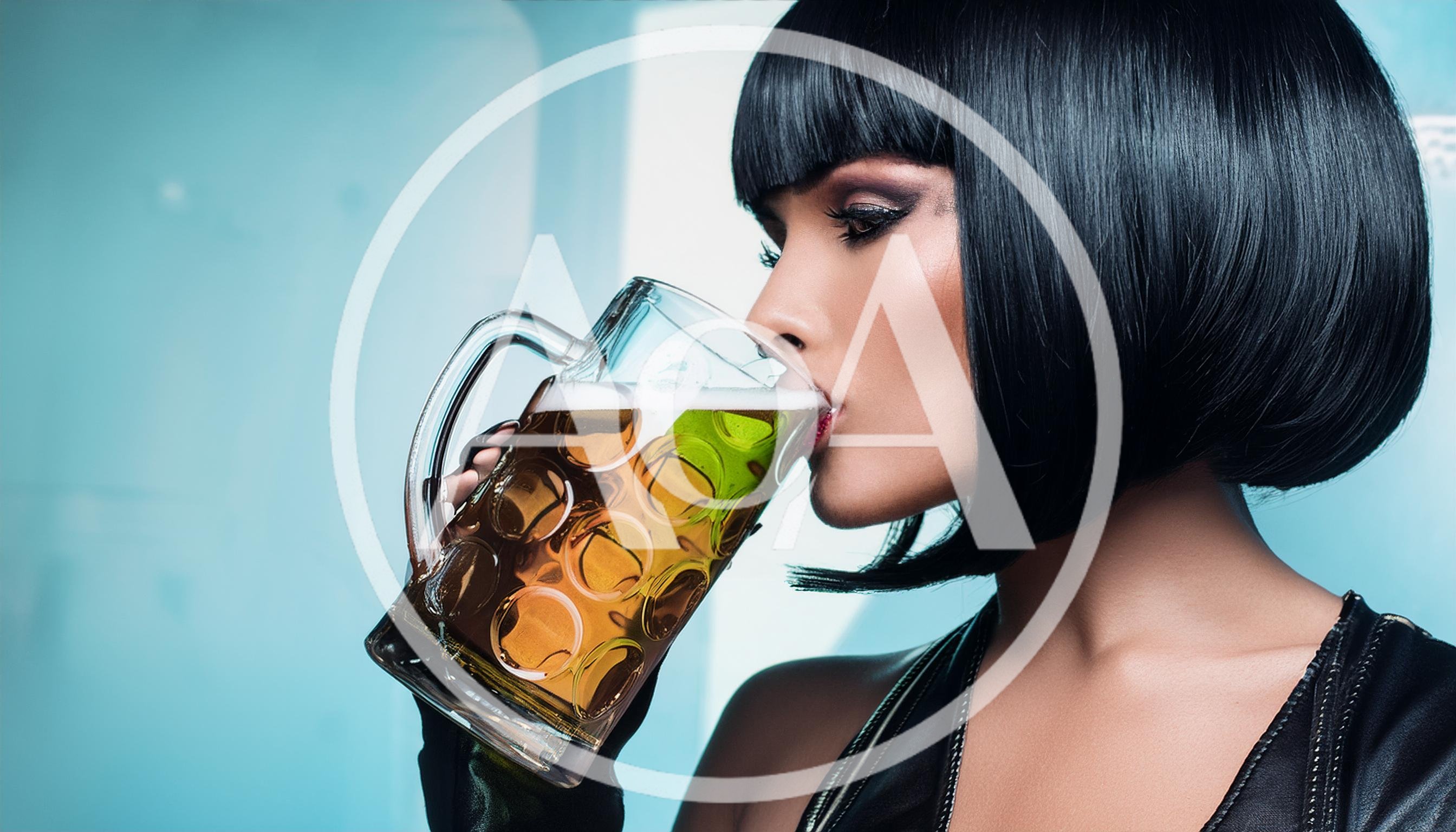 Woman With Bob Haircut Drinking Beer From Glass Mug