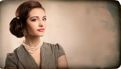 Elegant Woman With Vintage Hairstyle And Pearl Necklace