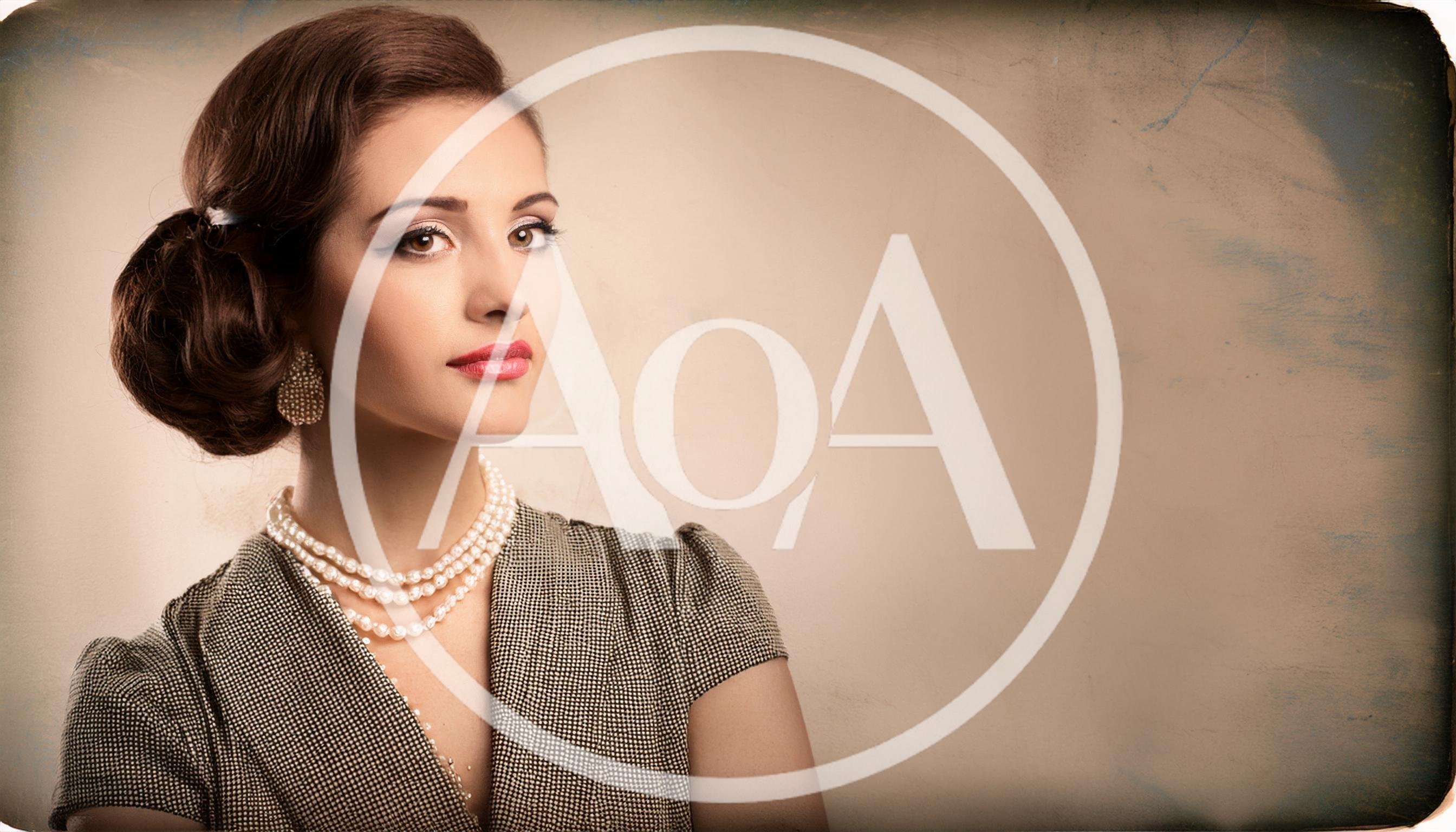 Elegant Woman With Vintage Hairstyle And Pearl Necklace