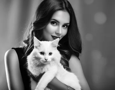 Elegant Woman Holding A Fluffy White Cat