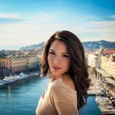 Beautiful Woman Posing Against A Scenic Coastal City Background