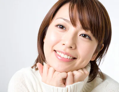 Portrait Of A Smiling Young Japanese Woman