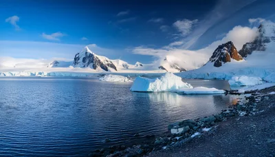 Antarctic Landscape With Glaciers And Snow Covered Mountains