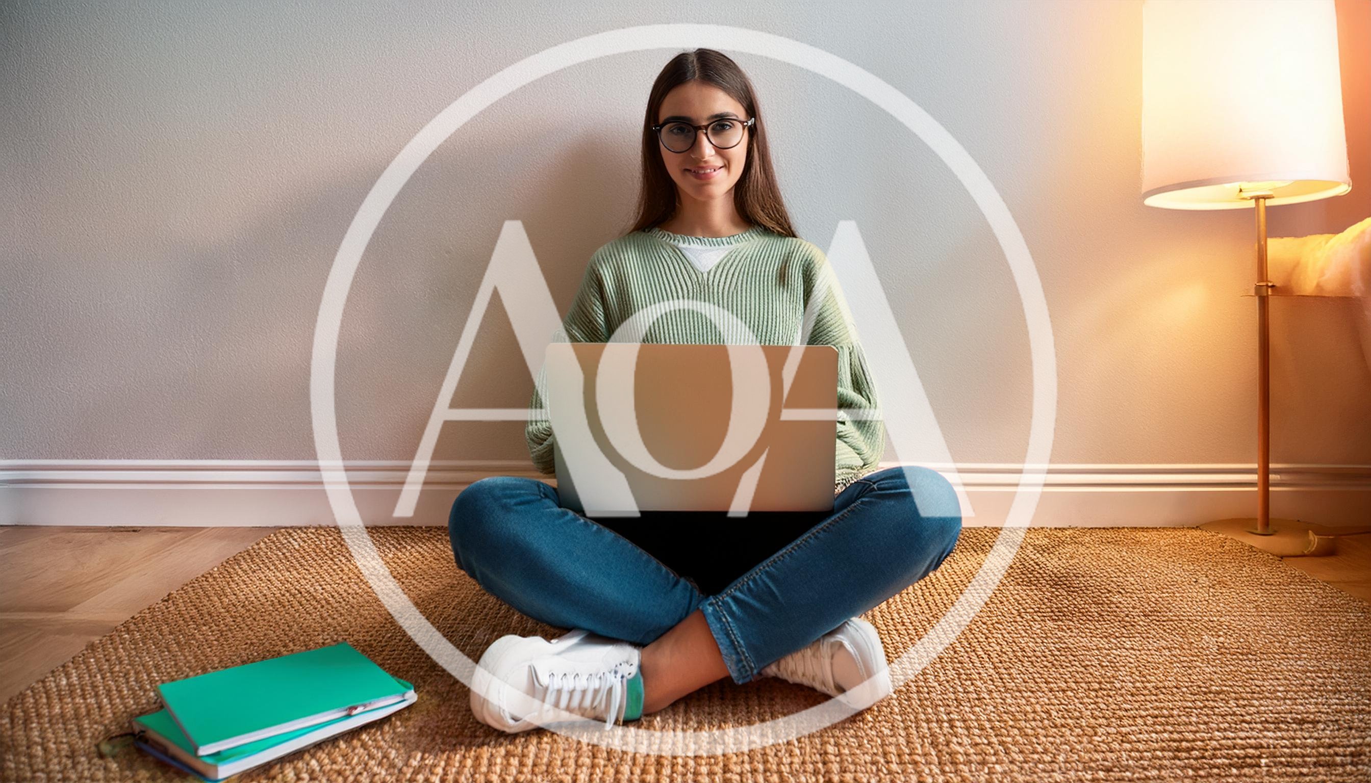 Young Woman Sitting On Floor Using Laptop