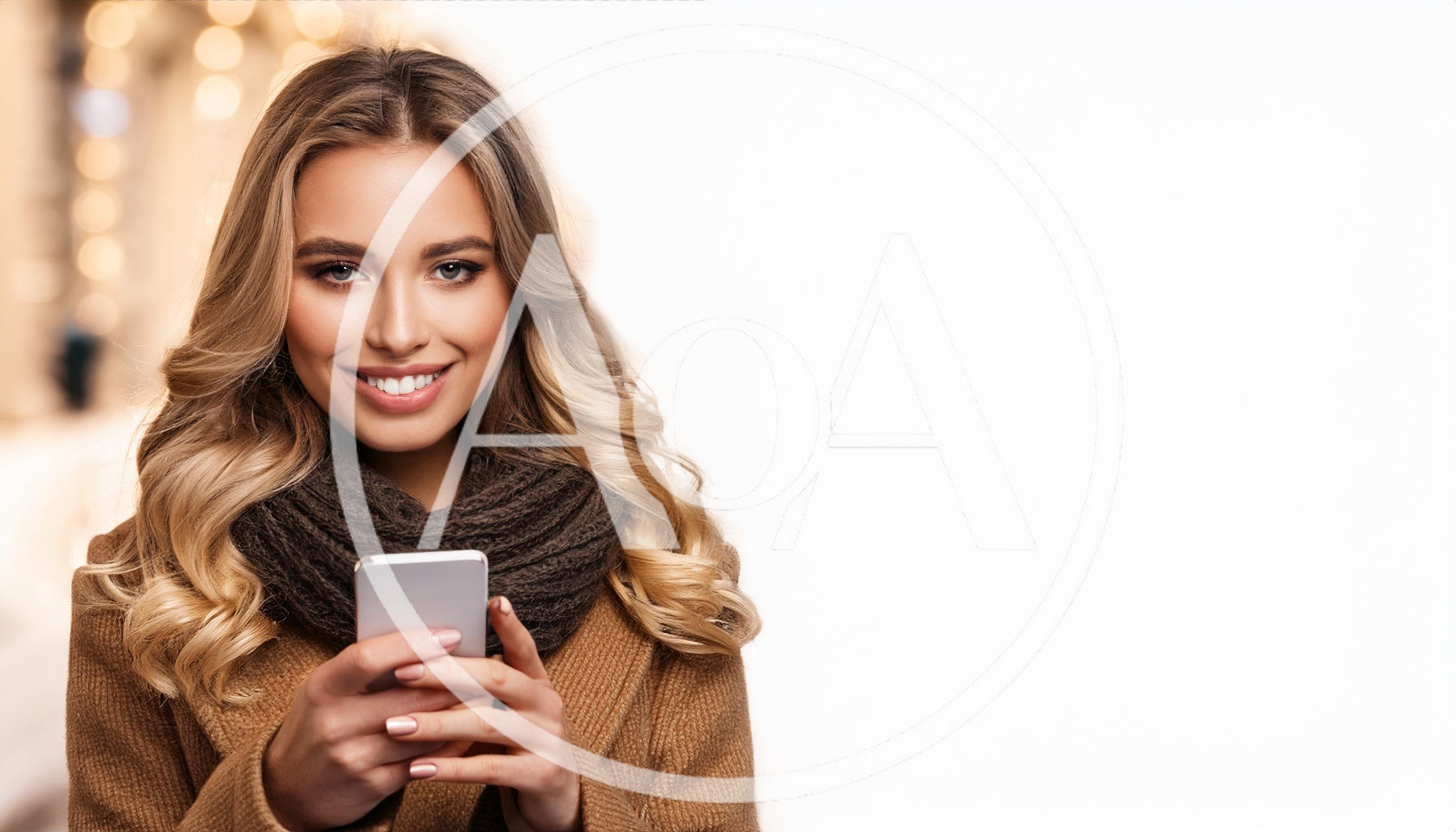 Smiling Young Woman Using Smartphone In Winter Clothing