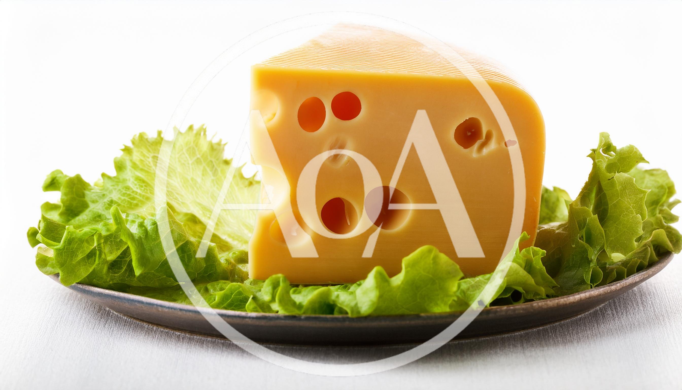 Wedge Of Swiss Cheese On A Bed Of Lettuce