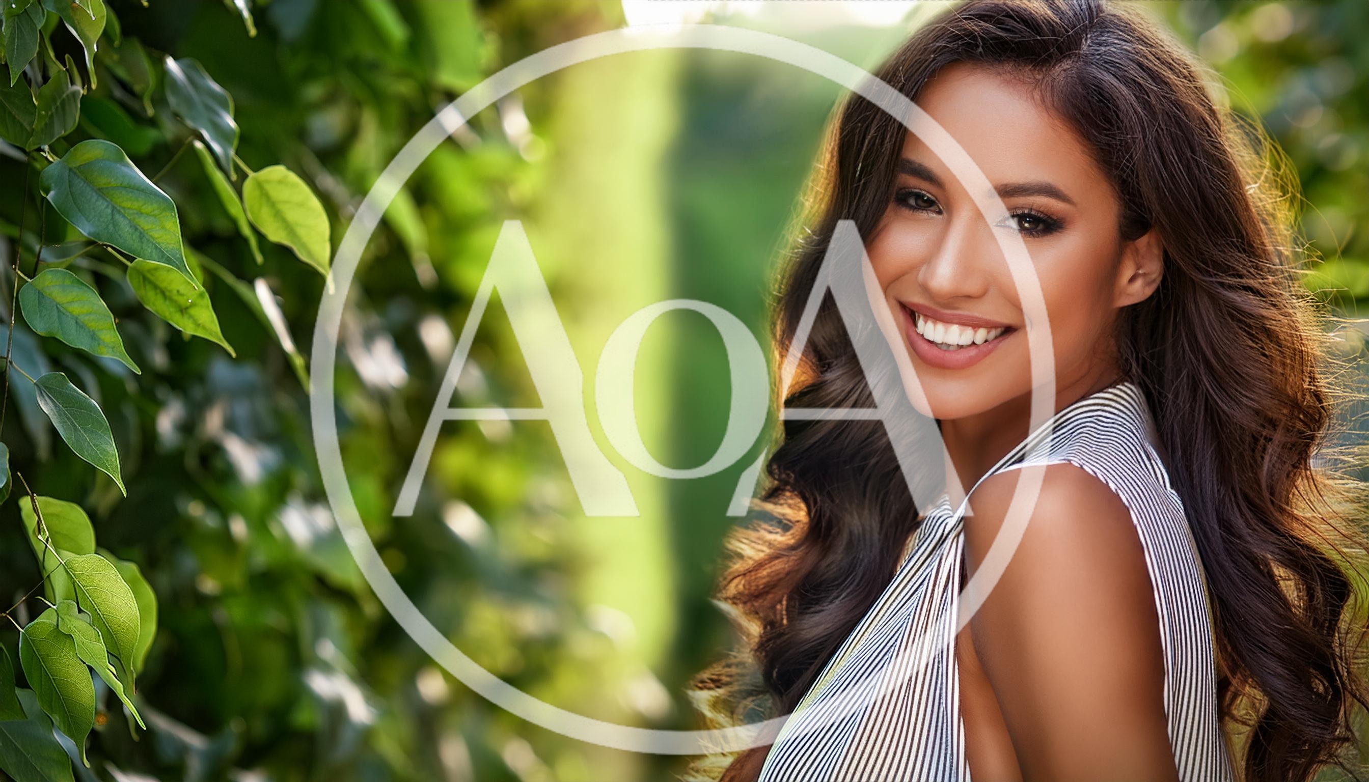 Portrait Of A Smiling Young Woman Outdoors