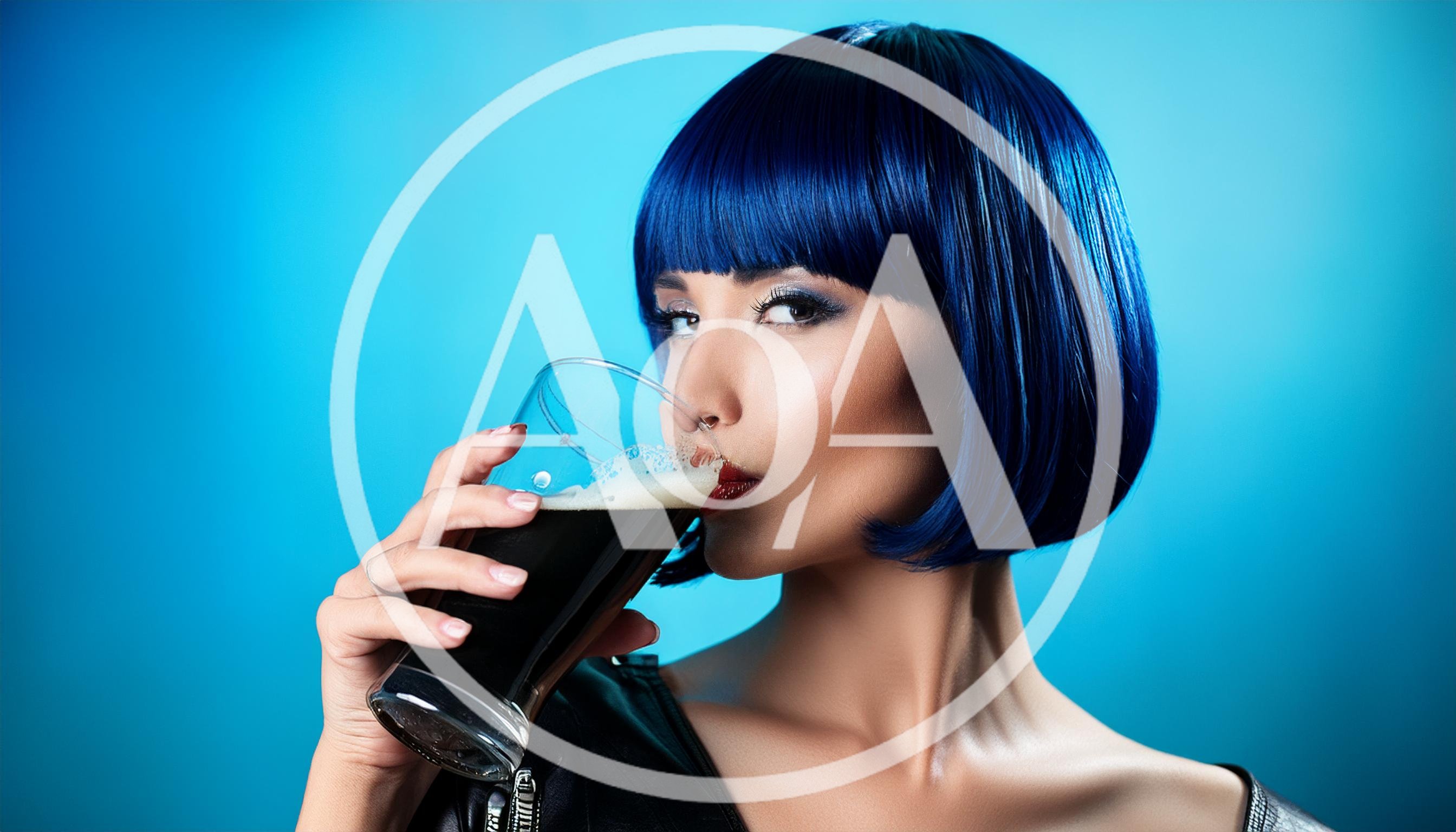 Woman With Blue Bob Hair Drinking Dark Beer