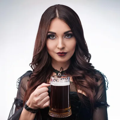 Gothic Woman Holding A Glass Of Dark Beer