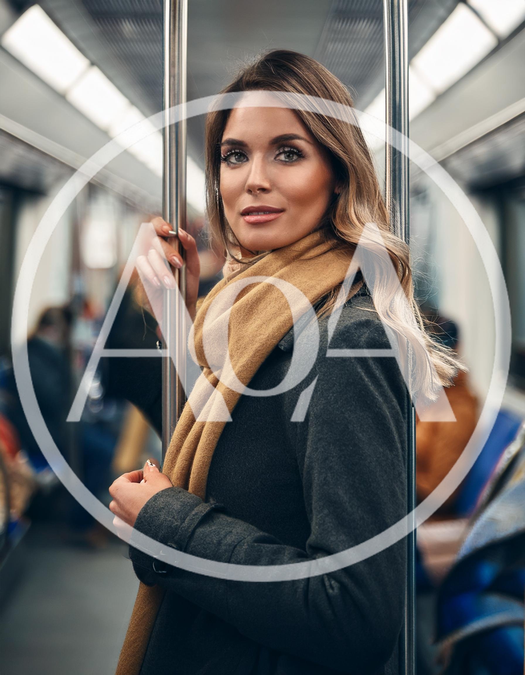Young Woman Standing Inside A Subway Train Car