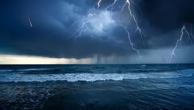 Dramatic Lightning Storm Over Dark Ocean Waves